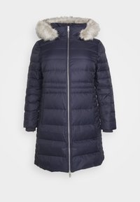 Marineblauer Steppmantel mit Kapuze aus Kunstfell, ausgestattet mit einem vorderen Reißverschluss, Steppmuster, langen Ärmeln und einer Länge bis zur Mitte des Oberschenkels.