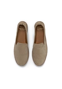 Beige suede espadrilles with a rounded toe, slip-on design, and braided jute sole. Features a smooth texture and a minimalist style.