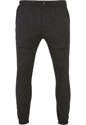 Meeste mustad spordipüksid, mis on valmistatud tekstuuriga kangast, küljetaskute, elastsete mansettide ja keha järgi sobiva disainiga.