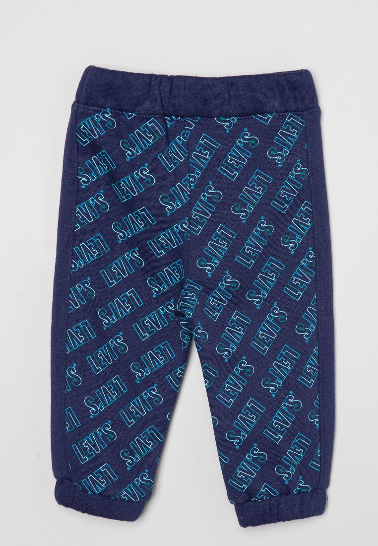 Pantalones de chándal azul marino de algodón, con un patrón impreso en todo el tejido que presenta el texto "LEVI'S" en azul claro. Cintura y puños elásticos.