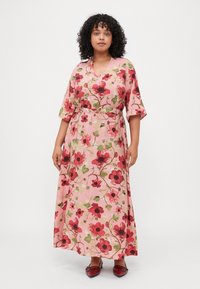 Floral midi dress with short, flared sleeves; pink base with red and green floral patterns; belted at the waist; lightweight fabric.