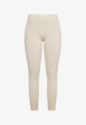 Bežīgas legingi ar gludu, elastīgu apdari. Augsts jostasvieta un pieguļošs dizains, bez redzamām šuvēm vai rakstiem.