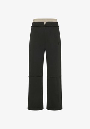 Schwarze Jogginghose mit beigem elastischem Bund, entspannter Passform, abgesteppten Details am Knie und kleinem seitlichem Logo.