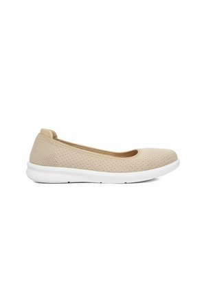 Beige knitted fabric slip-on flat shoe with rounded toe and white cushioned sole.