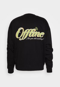 Sudadera negra con gran texto en verde y naranja que dice "Offline" y un texto más pequeño en blanco debajo que dice "¿Sigues viendo?" en la parte de atrás.