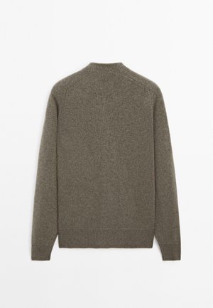 Olive green sweater, made of soft, textured fabric. Features a crew neck, long sleeves, and ribbed hems. Simple design with no motifs.