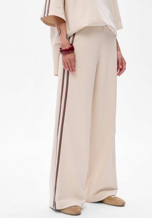 COSSA - Tracksuit bottoms - beige