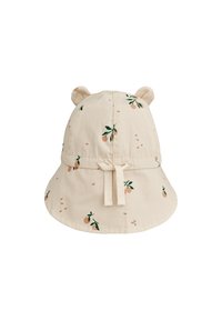 Bēša spainīša cepure ar ziedu rakstu, ar ausu formām līdzīgām uzmavām augšpusē, regulējamu auklu un plašu malu saules aizsardzībai.