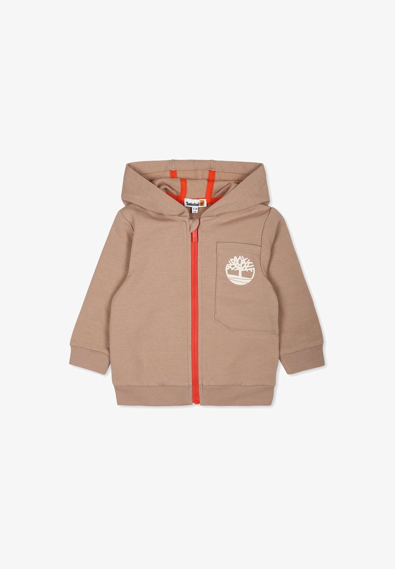 Felpa zip con cappuccio beige con zip arancione, tasca anteriore e logo bianco. Presenta una texture morbida e un cappuccio. Adatta per un abbigliamento casual.