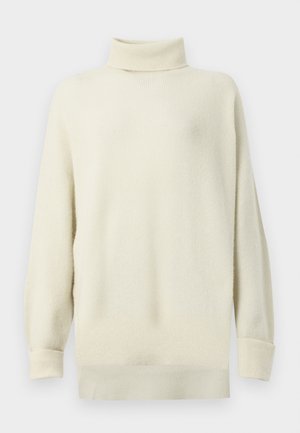 Cremefarbener Rollkragenpullover mit gerippter Textur, lockerer Passform und überschnittenen Schultern. Mit langen Ärmeln und gerade geschnittenem Saum.