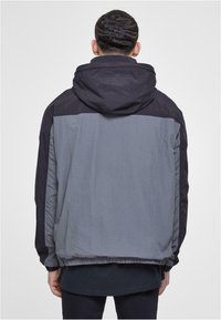 Karl Kani RETRO SPLIT  - Windbreaker - black