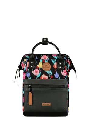 Black backpack with colorful floral pattern, two handles, front zippered pocket, and brown logo patches on pocket and upper section.