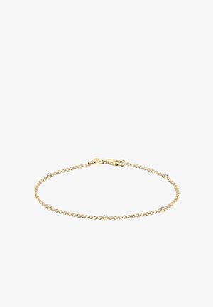 Auksinė grandinėlė su apvaliais žiedais, su penkiais tolygiai išdėstytais skaidriais brangakmeniais, užsegama krabų užsegimu.