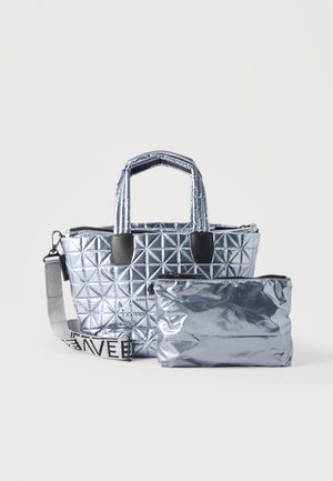 Metallic silver quilted handbag with padded handles and detachable strap, accompanied by a smaller matching zippered pouch.