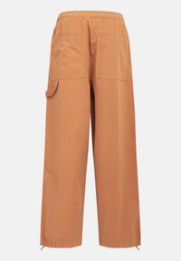 Wide-legged cargo pants in a warm brown color, featuring an elastic waistband, two back pockets, and adjustable ankle cuffs.