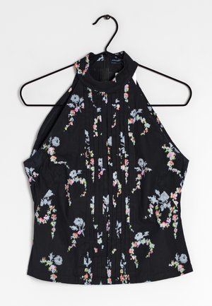 Musta hihaton yläosa, jossa vaaleansininen ja vaaleanpunainen kukkakuvio. Siinä on laskoksia ja korkea pääntie, valmistettu kevyestä kankaasta. Ripustettu koukkuun.