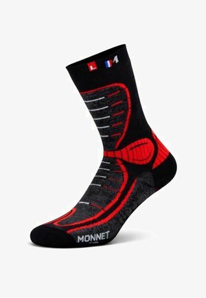 Schwarze und rote Sportsocke mit grauen Akzenten, mit dem Markennamen "Monnet" und der Größenangabe "L M" am oberen Rand.