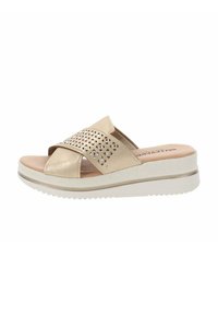 Sandalo piattaforma beige scorrevole con fasce incrociate, design perforato e suola bianca texturizzata. Presenta un plantare imbottito per il comfort.