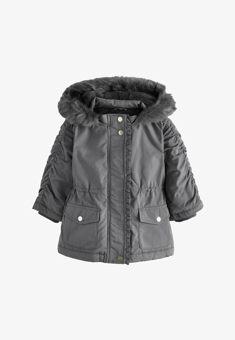 Szürke szigetelt dzseki, prémes kapucnival, puffos ujjal, fodros elejével, és két elülső zsebbel, patenttal zárható. Puha tapintású.