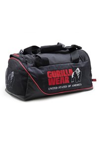 Black duffle bag made of durable fabric with red accents. Features mesh side panel and "GORILLA WEAR" logo prominently displayed.