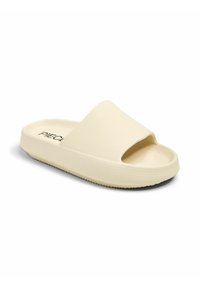 Sandale à glissière beige clair avec une sangle texturée et un bout ouvert. Elle présente une épaisse semelle et une texture en caoutchouc au dessous pour une meilleure adhérence.