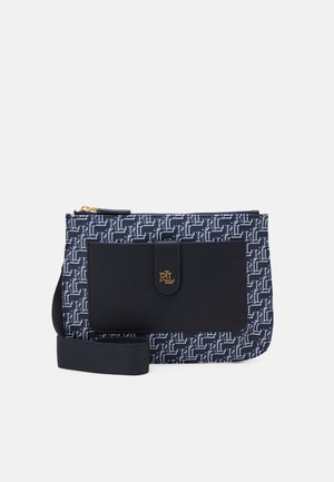 Navy crossbody bag with repeating white "RL" pattern, black front pocket secured by strap with gold "RL" logo, and adjustable black shoulder strap.