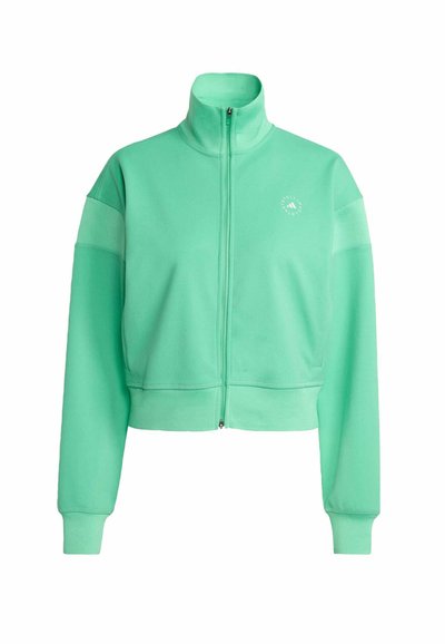 Giacca cropped verde menta con zip realizzata in tessuto morbido, dotata di maniche lunghe e colletto alto. Dettaglio logo discreto sul davanti.