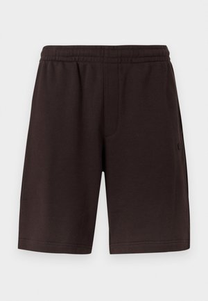 Mørkebrune bomullsshorts med elastisk midjebånd og sidelommer. Designet har en enkel og jevn tekstur, uten mønster.