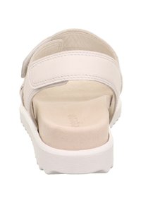 Weiße Sandale mit einem glatten Lederoberteil und zwei verstellbaren Riemen. Strukturierter Fußbett und weiße Gummisohle. Minimalistisches Design in neutraler Farbe.