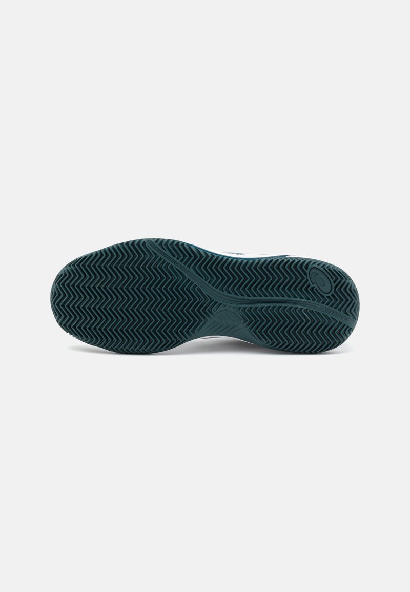 Suola di scarpa con un profondo motivo a zigzag in gomma verde scuro; eleganti dettagli neri vicino al tallone; design pulito e contemporaneo.