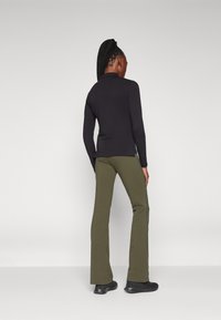 Champion ICONS HIGH WAIST FLARE LEGGINGS - Tamprės - dark green