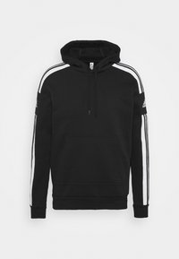 Sweat à capuche noir avec des bandes blanches sur les manches, poche kangourou devant et logo Adidas sur le haut du bras.