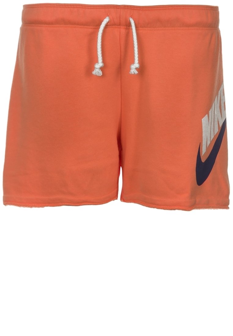 Oranžové šortky Nike vyrobené z měkkého směsového bavlněného materiálu, s elastickým pasem na šňůrku a velkým námořnickým logem u spodního lemu.