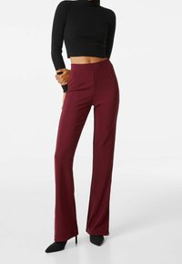 Bershka Tygbyxor - dark red