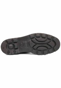 Suela de zapato de goma negra con dibujos profundos, ranuras para tracción, superficie texturizada y acentos moldeados para estabilidad y agarre.