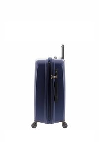 Valigia rigida blu navy, con superficie texturizzata, manico retrattile e quattro ruote per la mobilità. Include cerniera e lucchetto.
