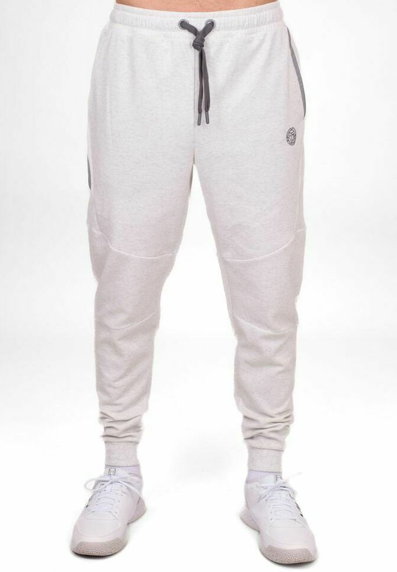 Hellgraue Sweatpants mit elastischem Bund, Kordelzug, Seitentaschen, gerippten Bündchen und einem kleinen Logo-Patch am Hüftbereich.