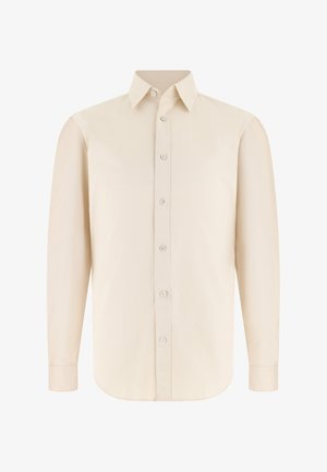 Camicia beige a maniche lunghe con colletto appuntito e sette bottoni frontali, esposta su sfondo bianco.