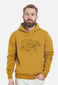 Senfgelbes Hoodie mit einem schwarzen geometrischen Bärenmotiv auf der Vorderseite, mit einer Kängurutasche und gerippten Bündchen.