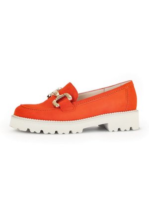 Orange suede loafers with a white chunky sole, featuring a gold buckle detail and stitching accents along the edges.