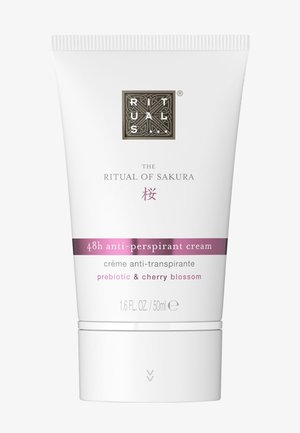 Crème anti-transpirante 48 heures Ritual of Sakura avec prébiotique et fleur de cerisier, tube blanc de 50 ml avec accents violets.