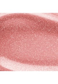 Surface rose lisse avec de fines taches blanches et une zone brillante et réfléchissante en bas à gauche.