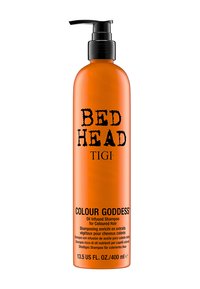 Orange plastflaska med pumplock, märkt "BED HEAD TIGI COLOUR GODDESS" och detaljer i svart tryck, 400 ml kapacitet.