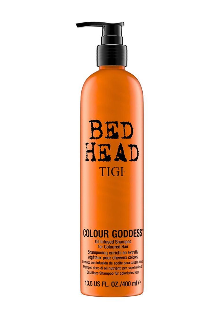 Orange plastflaska med pumplock, märkt "BED HEAD TIGI COLOUR GODDESS" och detaljer i svart tryck, 400 ml kapacitet.