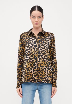 Leopardmønstret skjorte med knapper i sort, brunt og beige toner. Glat stof med lange ærmer og klassisk krave.