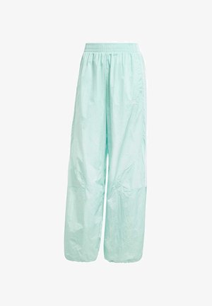 Licht mintgroene, lichte nylon joggingsbroek met een elastische tailleband, twee zijzakken en witte zijstrepen. Geaccentueerd met logo-opdruk.