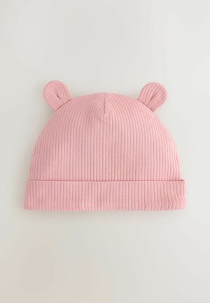 Rosa ribbad stickad mössa med en uppvikning, försedd med två små upprätta öron på toppen. Mjuk textur och elastiskt material för komfort.