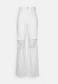 Denim branco com cintura alta e perna larga, apresentando detalhes de rasgos nos joelhos e uma textura suave. Design clássico de cinco bolsos.