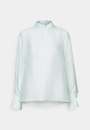 Light blue, long-sleeve blouse with a high collar, soft texture, and a relaxed fit. Features buttoned cuffs and a straight hem.