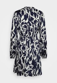 Navy blue dress with long sleeves and elastic waist, featuring an abstract white brushstroke pattern, shown from the back.